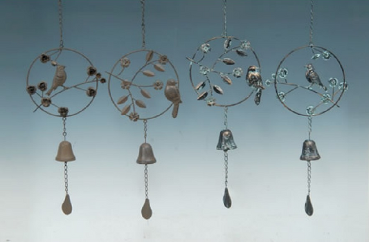 Decorative metal wind chimes with birds and bells against a blue sky background