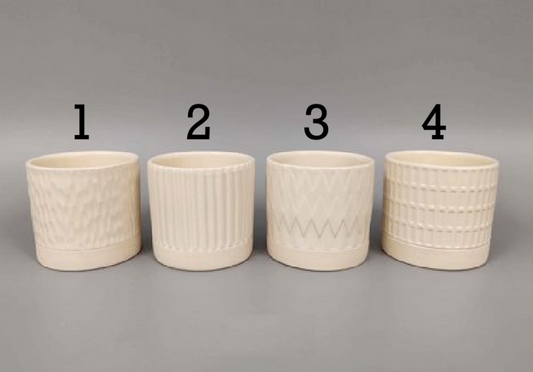 Four beige porcelain planters with textured patterns on a gray background