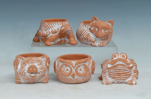 Terracotta animal-shaped pots on a white background.  Turtle, Fox, Pig, Owl, and Frog.